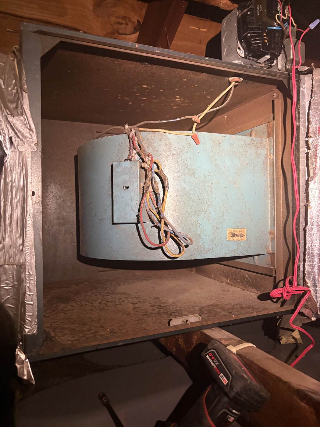 Air-handler blower cabinet opened up for service by Tom Falk.