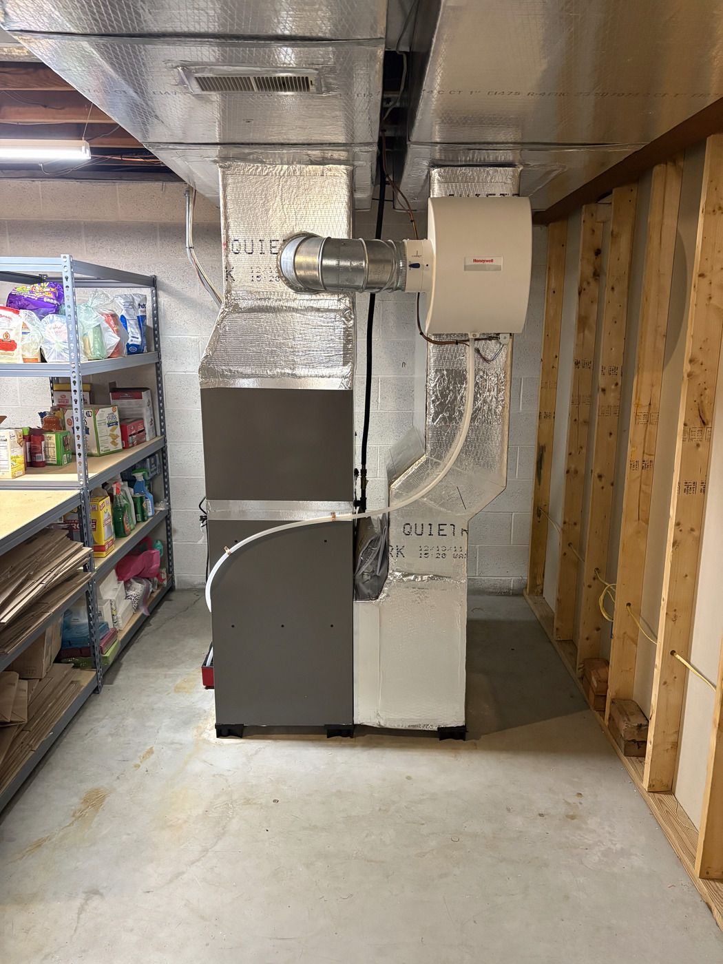 High-efficiency furnace with a Honeywell whole-house humidifier, installed by Tom Falk.