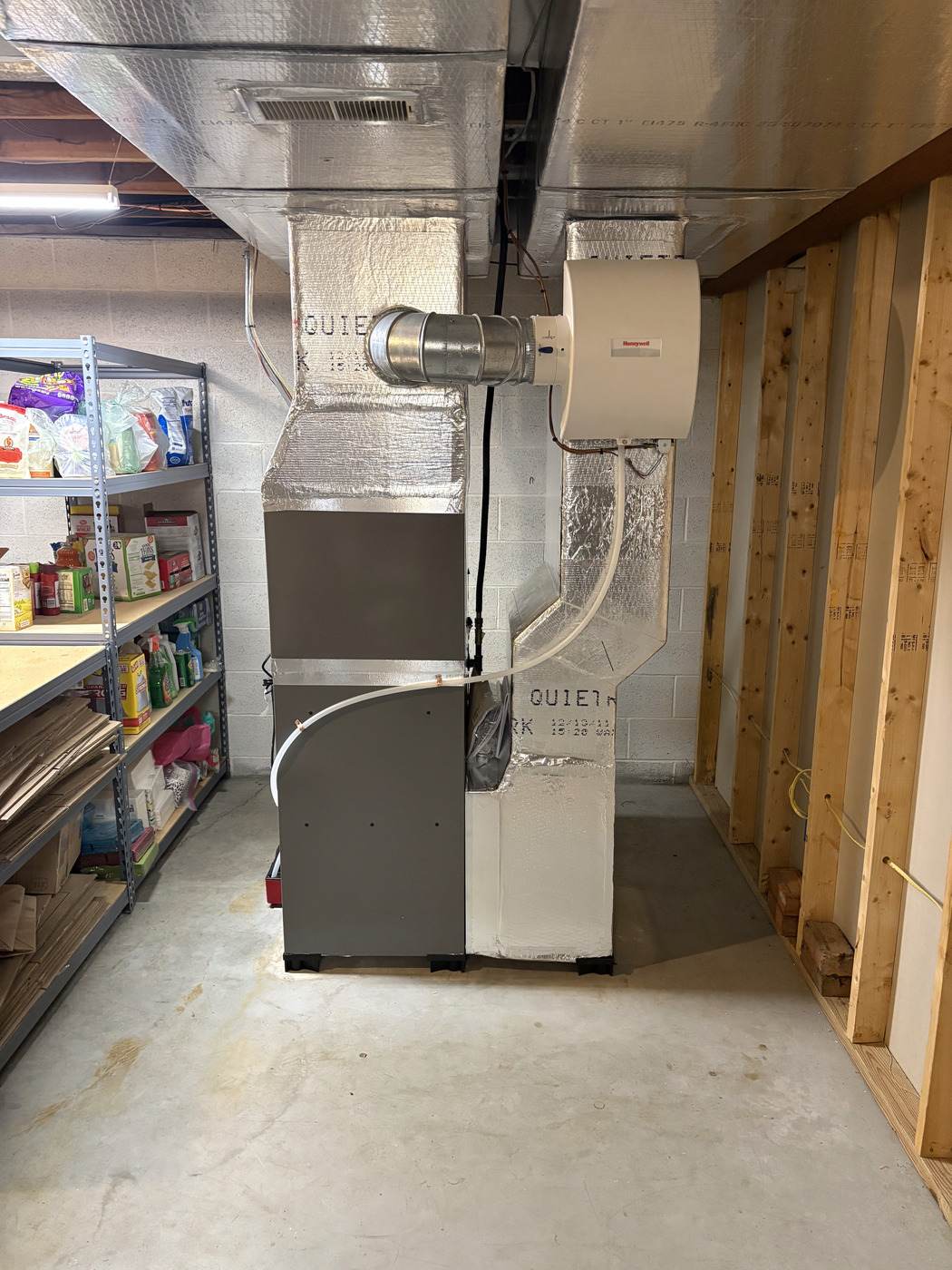 High-efficiency furnace with a Honeywell whole-house humidifier, installed by Tom Falk.