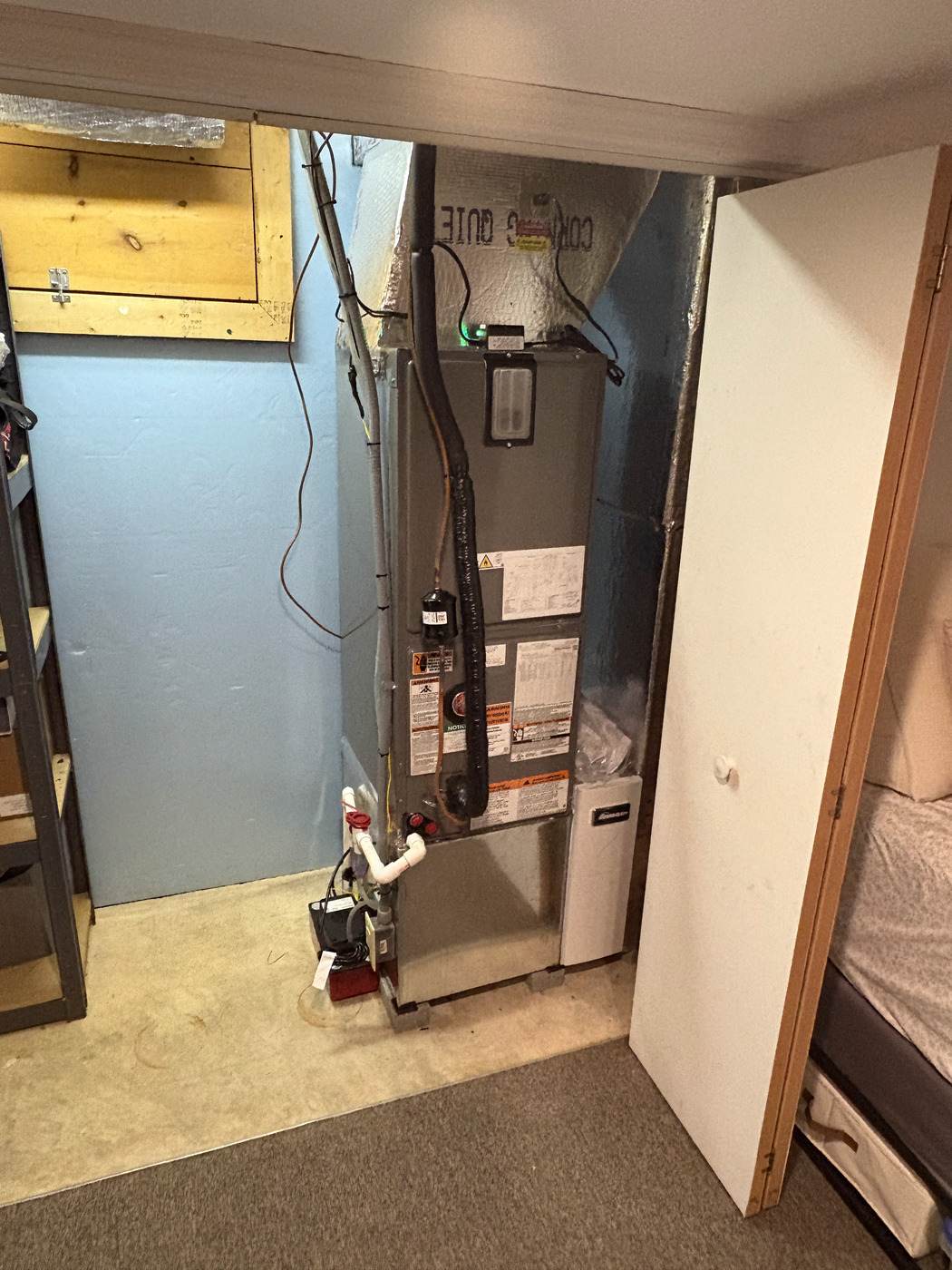 Rheem air handler fitted into a tight basement closet by Tom Falk.